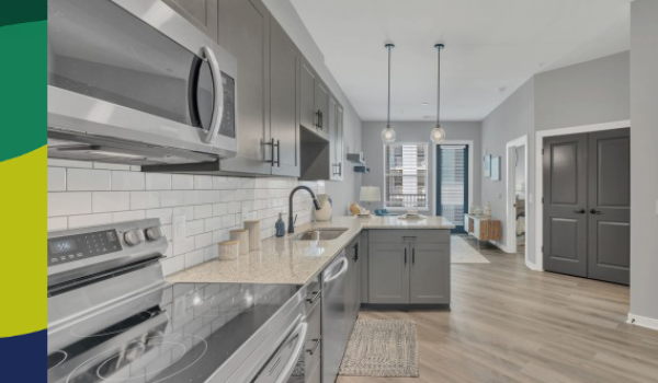 a kitchen with gray cabinets